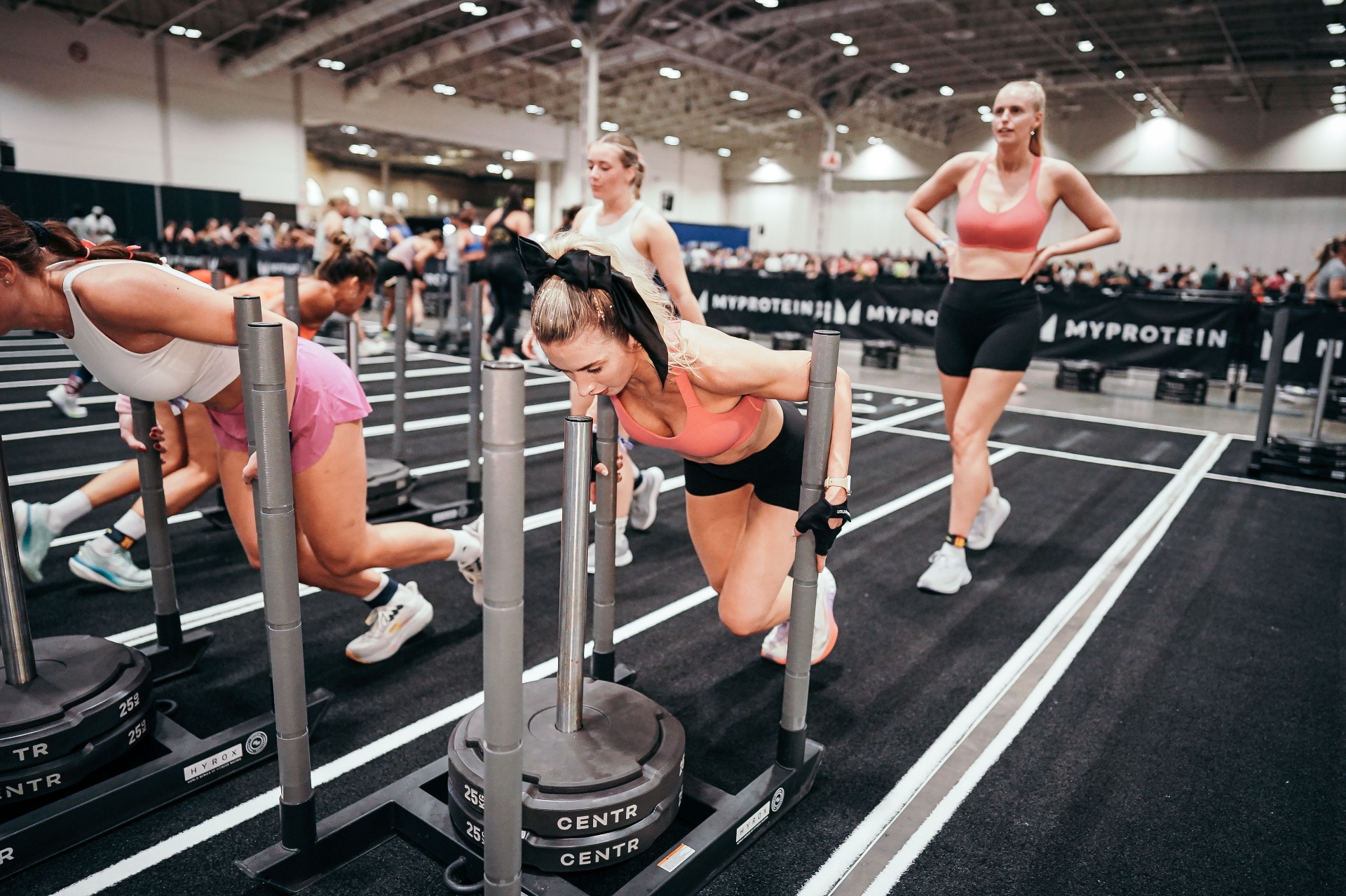 Health Hops team member training at a Hyrox-style event